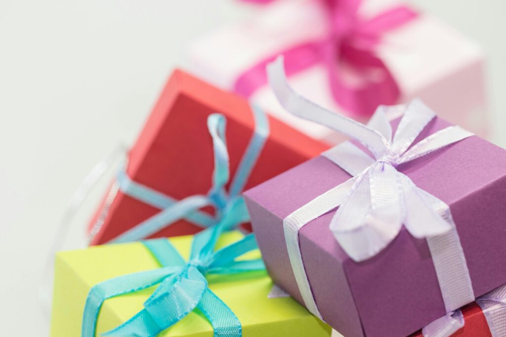 Close-up of vibrant gift boxes with ribbons, perfect for festive occasions.